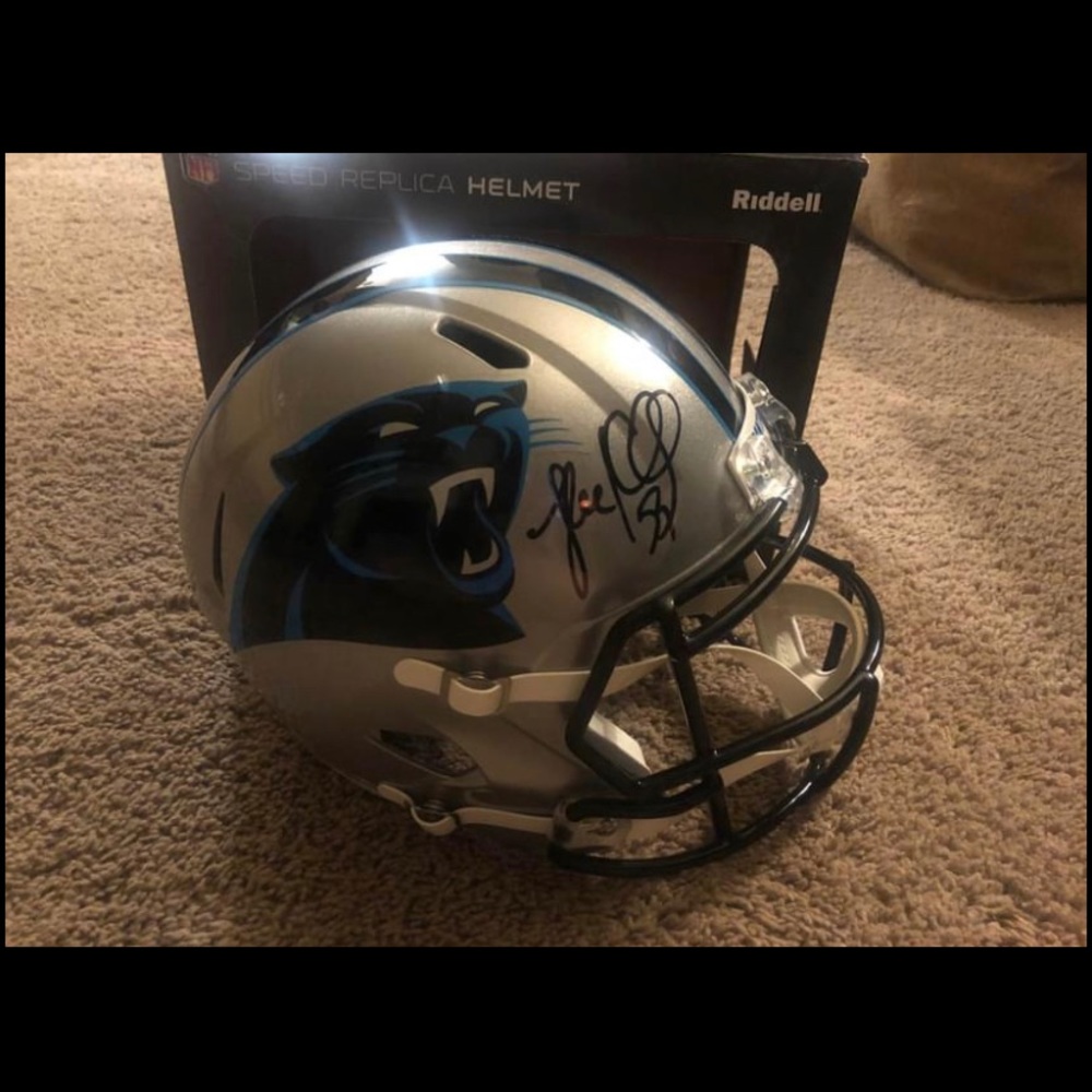 Full size signed Luke Keuchly replica helmet